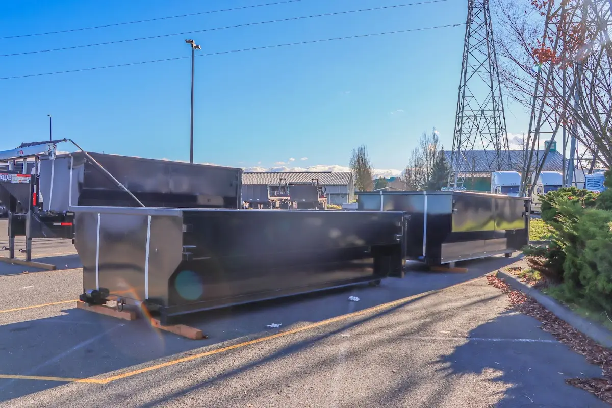 Roll-off dumpster ready for waste disposal at job site for 3 Yard Dumpster Rental in Kinston